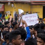 Protest in Dhaka highlighting educational reform and justice demands.