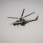 A military attack helicopter flying in the sky over Belgrade, Serbia.