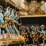 Vibrant handmade Goddess Kali idols displayed in a Kolkata workshop.