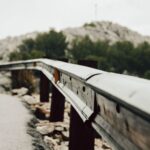 Close-up of a metal guardrail on a mountain road in Mallorca, Spain.