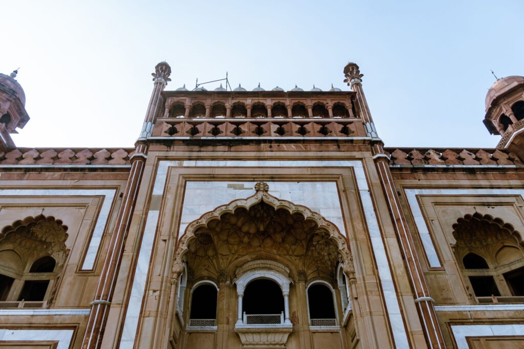 A detailed view of the stunning Safdarjung Tomb facade in New Delhi, showcasing intricate Mughal architecture.