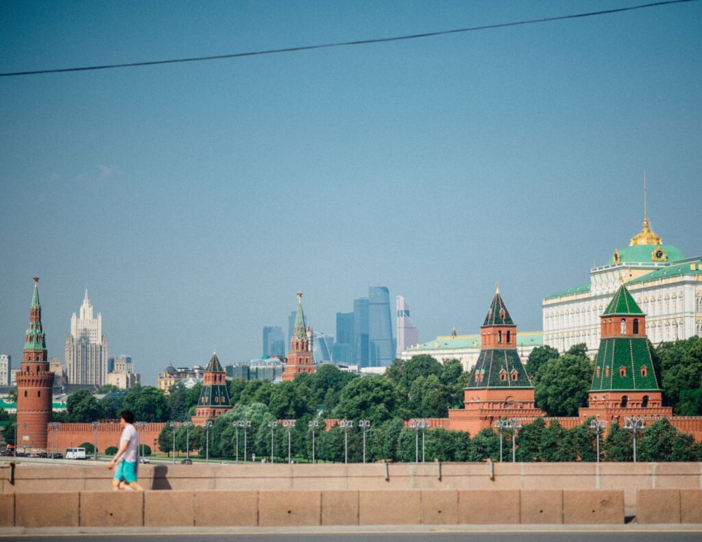 A scenic view of the iconic Kremlin towers in Moscow, capturing the blend of historical and modern architecture.