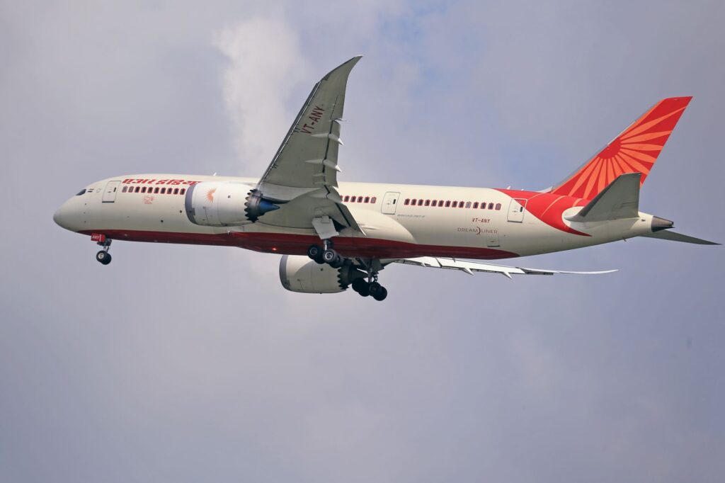 Commercial airplane cruising through the sky, symbolizing travel and aviation.