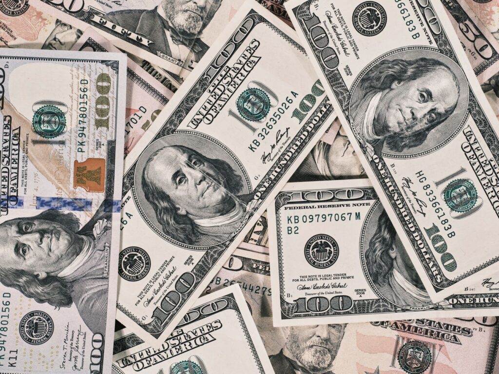 Detailed close-up of US dollar bills highlighting wealth and finance concepts.