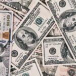 Detailed close-up of US dollar bills highlighting wealth and finance concepts.