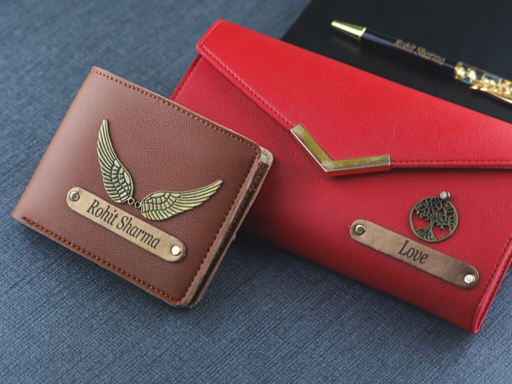 Stylish leather wallet and purse set with personalized pen on blue fabric. Ideal for fashion accessories.