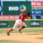 Dynamic shot of a baseball player sprinting on the field in Santo Domingo, Dominican Republic.