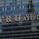 Detailed facade view of the Trump building with reflective glass windows.