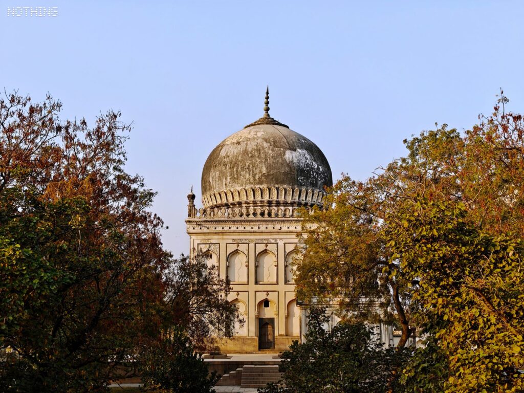 Explore the grandeur of a Qutb Shahi Tomb amidst nature in Hyderabad, India.