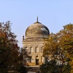 Explore the grandeur of a Qutb Shahi Tomb amidst nature in Hyderabad, India.