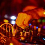 Vibrant DJ performance capturing the essence of night parties in Mexico City with dynamic lighting and music equipment.