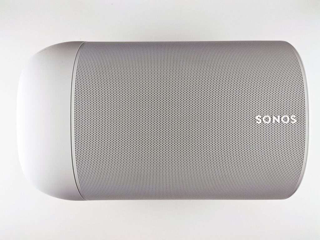 Top view of a sleek wireless speaker with a minimalistic design.