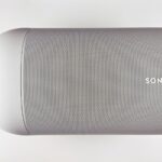 Top view of a sleek wireless speaker with a minimalistic design.
