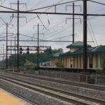 Scenic view of railroad tracks at Rahway Station, New Jersey, on a cloudy day.