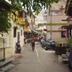 A quaint alley in Mumbai featuring local architecture and daily life.
