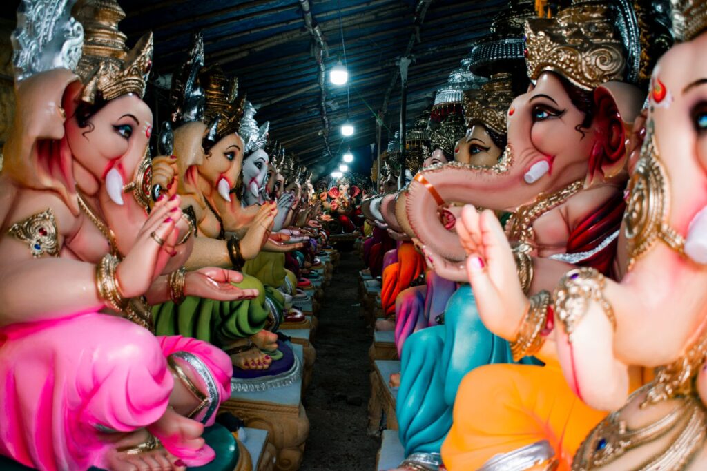 Vibrant Ganesha idols prepared for Ganesh Chaturthi festival in Hayathnagar, India.