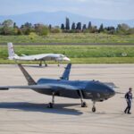 Advanced military drones on a tarmac in Istanbul, Turkey, showcasing modern aerial technology.