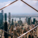 A stunning aerial view of Manhattan's skyline featuring prominent skyscrapers and urban landscape.