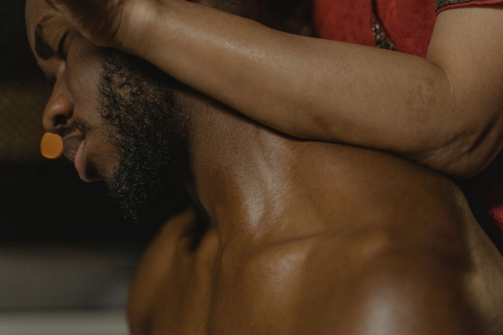 Close-up of a man enjoying a relaxing massage, highlighting tranquility and wellness.