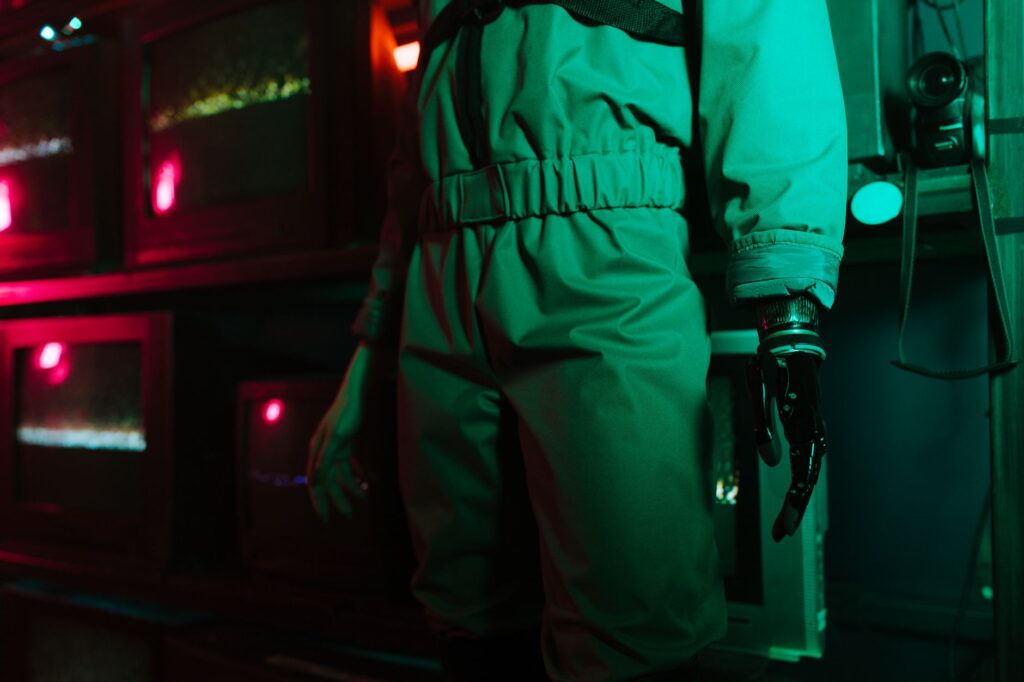 A cyberpunk setting featuring a person with a robotic arm amidst neon and retro elements.