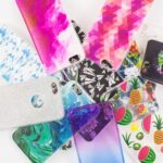 Colorful and decorative phone cases in various patterns and designs.
