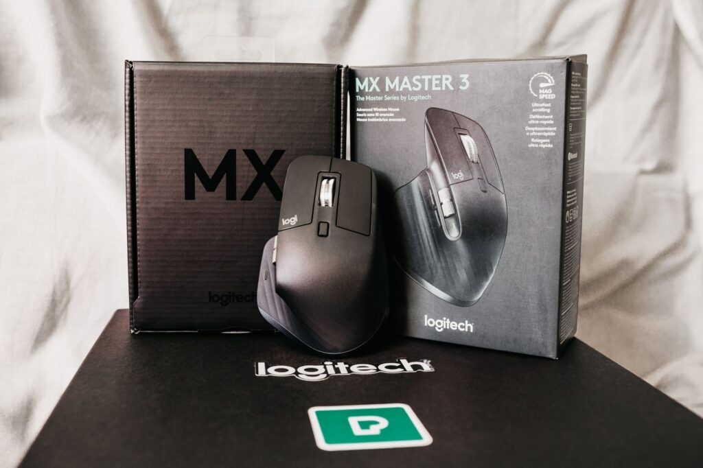 Modern black computer game mouse near box with text of description of functions