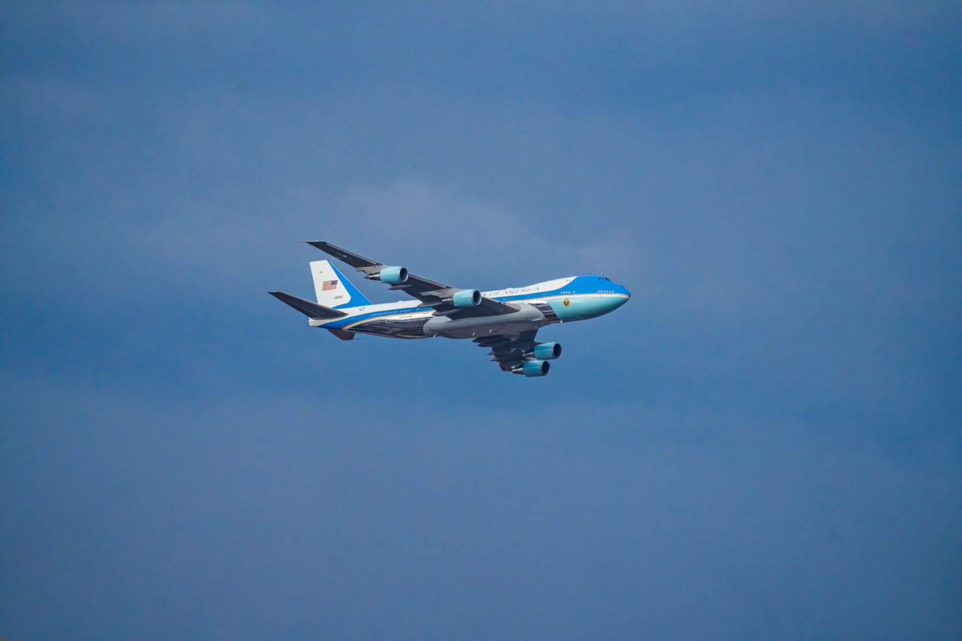 Air Force One airplane flying in the clear blue sky over Washington, DC.