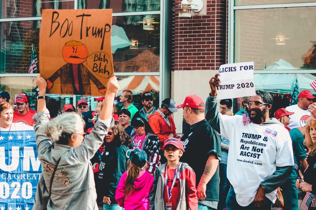 Protest and support dynamic at a political rally in Wheeling, West Virginia.
