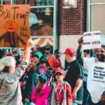 Protest and support dynamic at a political rally in Wheeling, West Virginia.