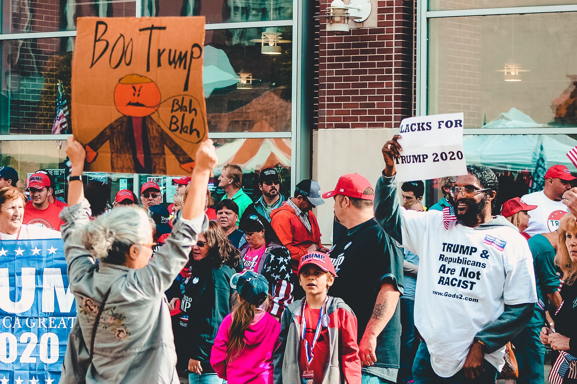 Protest and support dynamic at a political rally in Wheeling, West Virginia.