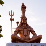 A striking statue of Lord Shiva under the open sky in Hajipur, India.