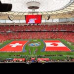 A vibrant soccer match between Switzerland and Canada in BC Place, Vancouver.