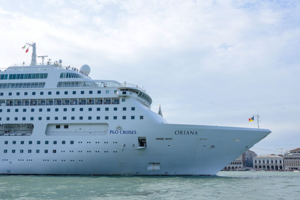 Luxurious cruise ship Oriana sailing through the waters, showcasing elegance and travel.