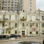 Street view of historic and modern buildings in Kyiv, Ukraine showcasing diverse architectural styles.