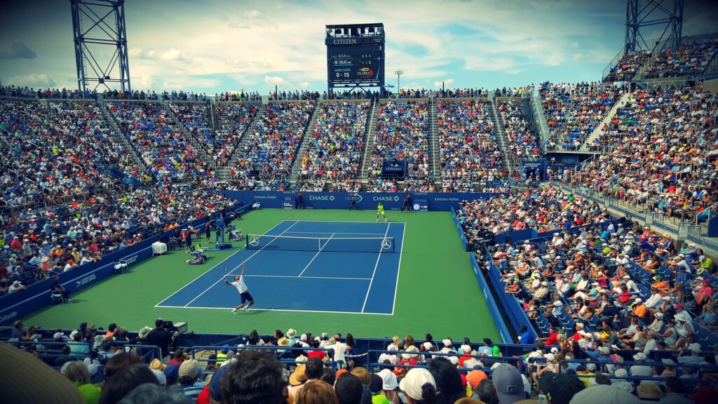 Thrilling tennis match at the US Open with a full stadium of enthusiastic fans.