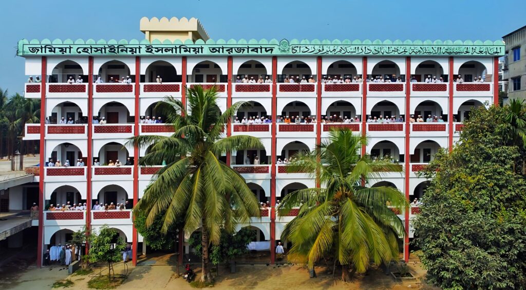 Aerial shot of an Islamic school building surrounded by palm trees in Dhaka, Bangladesh.