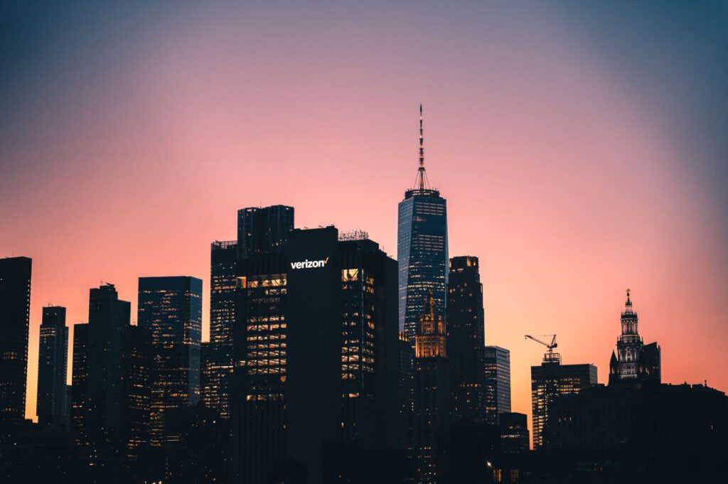 Captivating sunset over Manhattan skyline featuring One World Trade Center in clear view.