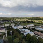 Aerial view of Більче-Золоте village, showcasing rural architecture and lush greenery.