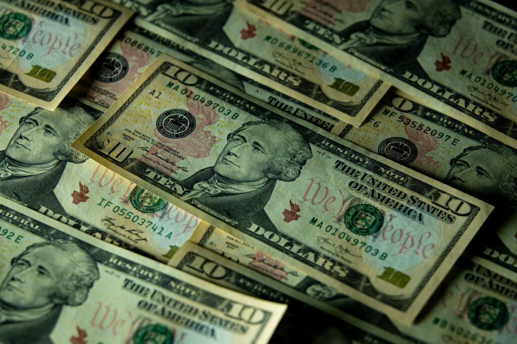 A detailed view of multiple ten dollar bills showcasing American currency and financial concepts.