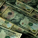 A detailed view of multiple ten dollar bills showcasing American currency and financial concepts.