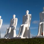Iconic Man Meets the Sea sculptures under a clear sky in Esbjerg, Denmark.