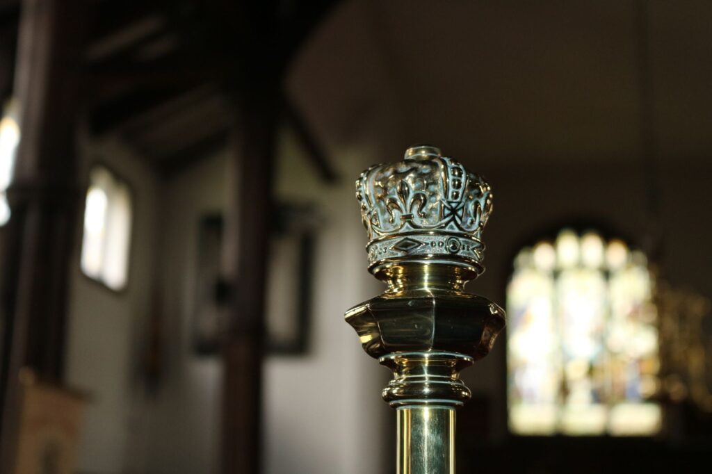Close-up of a decorative crown detail inside a historic church in Holmes Chapel, England.