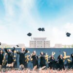 Graduates celebrate their success by tossing caps at Wuhan University, China.