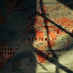 From above of sunlit aged paper world map with continents countries and oceans