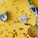 Conceptual flat lay of a trophy, medal, and clock with 'FOR WIN' letters, symbolizing victory and achievement.