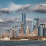 Captivating view of the New York City skyline featuring One World Trade Center on a sunny day.