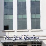 Close-up of the New York Yankees Team Store facade, featuring modern architecture.
