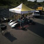 High-angle view of a racing car setup under a tent in Kruje, Albania.